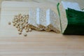 raw tempeh. soybeans and sliced Ã¢â¬â¹Ã¢â¬â¹raw tempeh on a wooden board